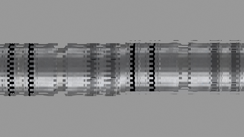 3D rendering of a Welltec downhole tool showing precision grooves and seals for zonal isolation and wellbore sealing.