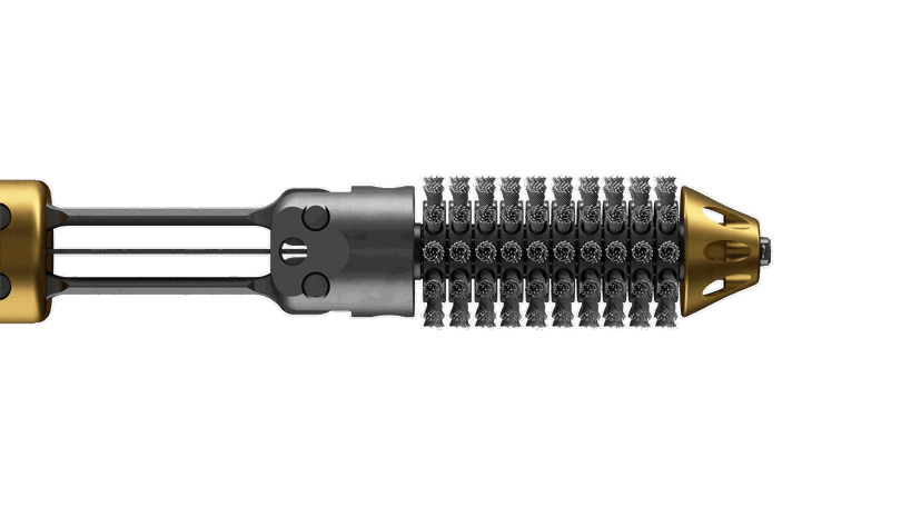 Well Cleaner Wishbone Honer tool with a metallic body, gold-colored section, and specialized cutting edge for efficient downhole operations.