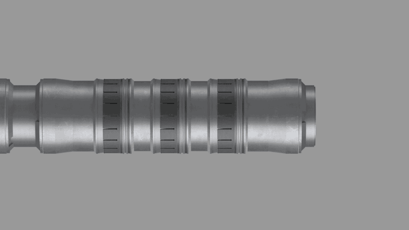 Detailed view of a metal tube from a Welltec® Expandable Anchor (WEA) on a black backdrop.