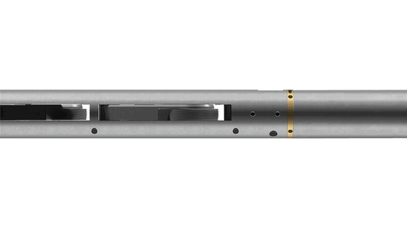 Welltec Tractor tool with a metallic body, gold colored ring, and internal mechanisms for efficient downhole operations.